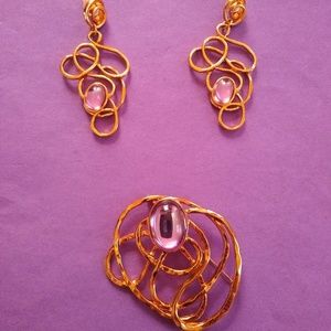 Pair of pierced earrings and brooche set